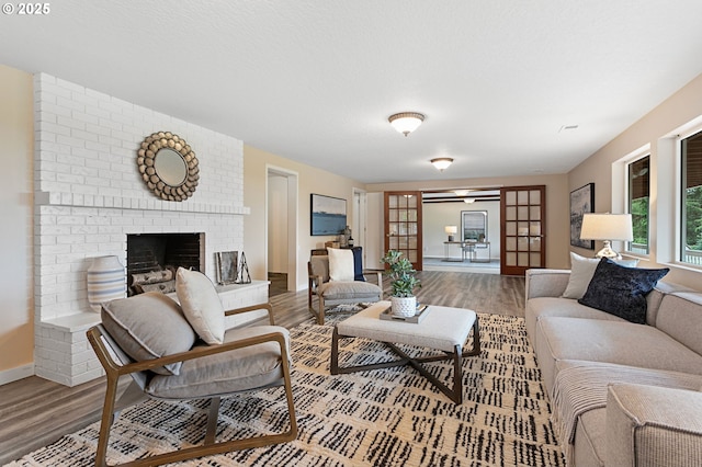 3025 SW Wallula Ave, Gresham, OR 97080 - living area featuring wood finished floors and a fireplace