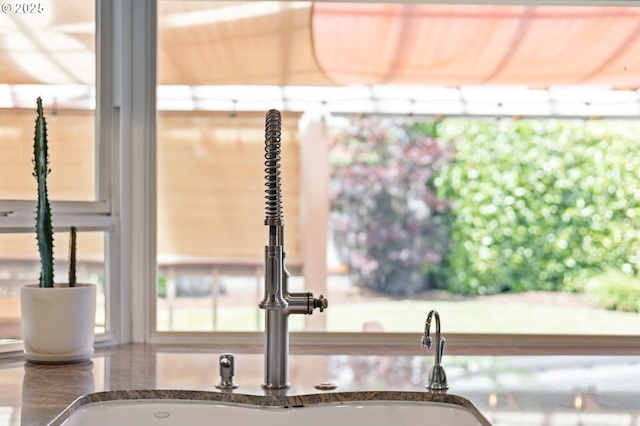 13355 SW Chimney Ridge Ct, Tigard, OR 97223 - kitchen view of a sink and dark stone countertops