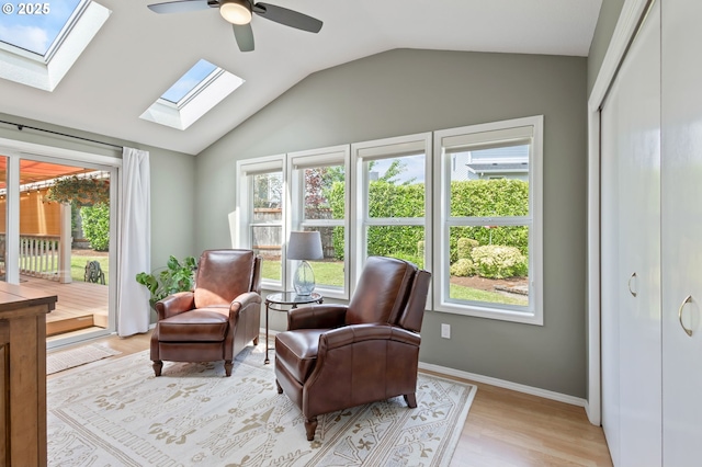 13355 SW Chimney Ridge Ct, Tigard, OR 97223 - living area featuring a skylight, lofted ceiling, a ceiling fan, and light wood-style floors