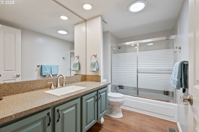 13355 SW Chimney Ridge Ct, Tigard, OR 97223 - full bath featuring vanity, combined bath / shower with glass door, wood finished floors, and recessed lighting