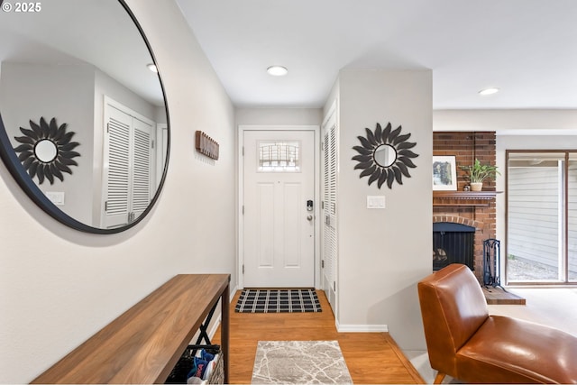 13355 SW Chimney Ridge Ct, Tigard, OR 97223 - foyer featuring wood finished floors, a fireplace, and recessed lighting