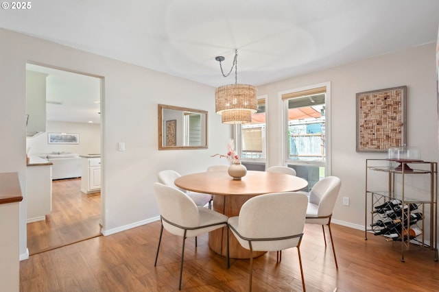 13355 SW Chimney Ridge Ct, Tigard, OR 97223 - dining room with light wood-style flooring and a chandelier