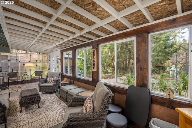 sunroom with coffered ceiling and plenty of natural light