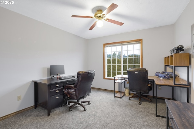 carpeted office with ceiling fan