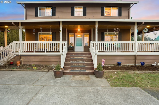 farmhouse featuring covered porch