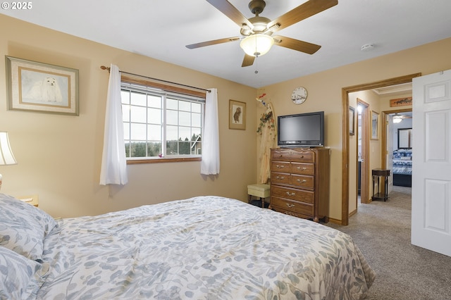 bedroom with ceiling fan and carpet flooring