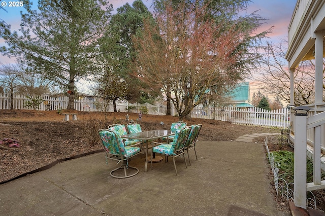 view of patio terrace at dusk