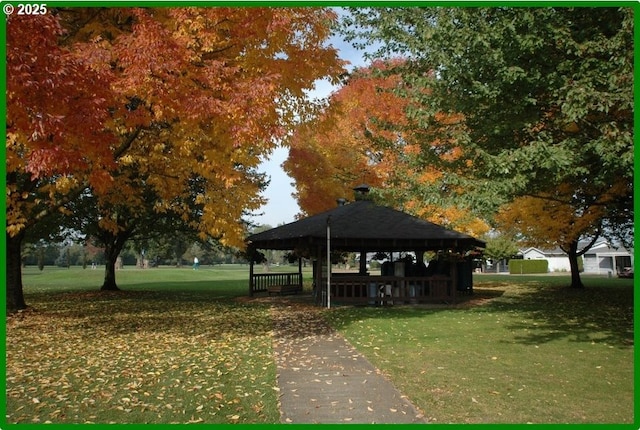 view of community with a gazebo and a lawn