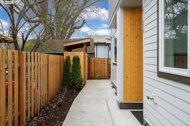 view of side of property featuring a patio area