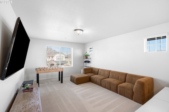 living room with light carpet and a textured ceiling