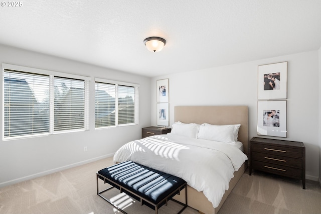 carpeted bedroom with a textured ceiling