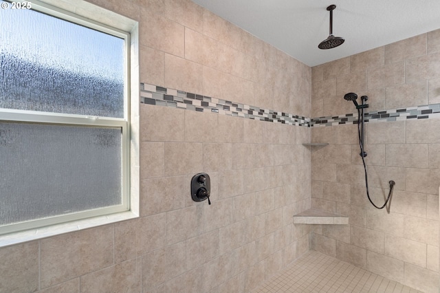 bathroom featuring tiled shower