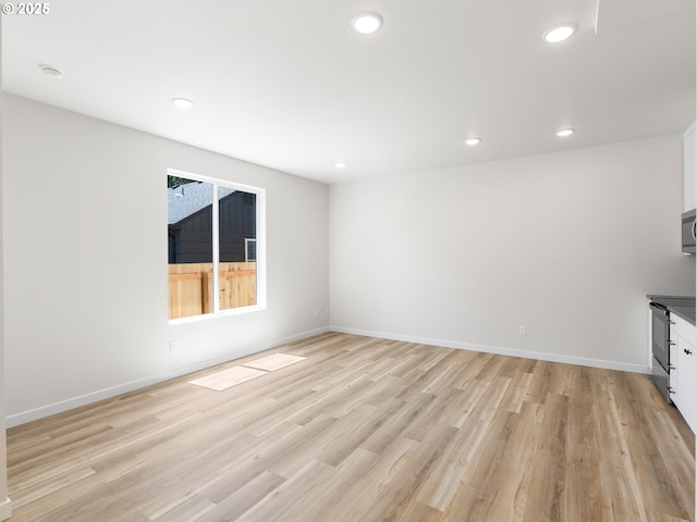 unfurnished living room featuring light hardwood / wood-style flooring