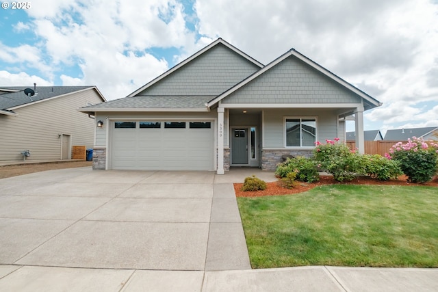 5300 Davis St SE, Turner, OR 97392 - craftsman-style house featuring a garage, stone siding, and driveway