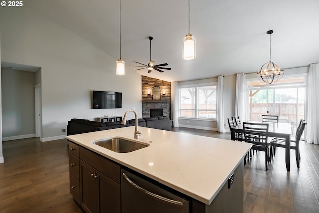 5300 Davis St SE, Turner, OR 97392 - kitchen featuring dishwasher, a stone fireplace, open floor plan, a ceiling fan, and dark wood-style floors