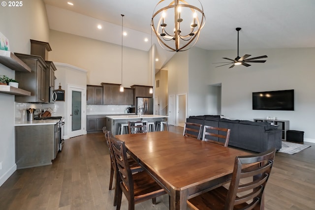 5300 Davis St SE, Turner, OR 97392 - dining room with high vaulted ceiling, a ceiling fan, dark wood-style flooring, a chandelier, and recessed lighting
