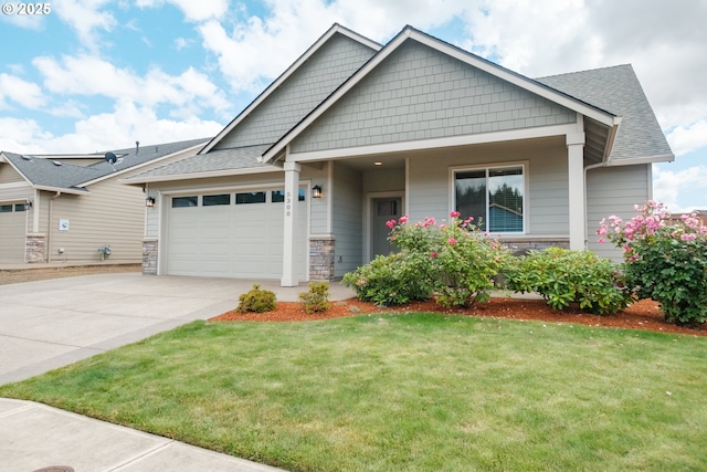 5300 Davis St SE, Turner, OR 97392 - craftsman-style home featuring concrete driveway, an attached garage, a front lawn, stone siding, and roof with shingles