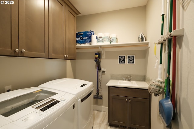 5300 Davis St SE, Turner, OR 97392 - laundry area with washing machine and clothes dryer, cabinet space, and light tile patterned floors