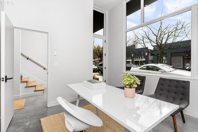 2795 NW Thurman St, Portland, OR 97210 - dining space featuring stairs and concrete floors