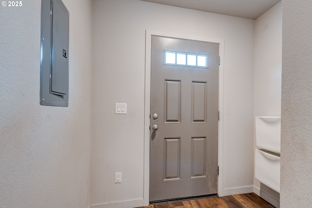 9911 SE Duke St, Portland, OR 97266 - foyer entrance with electric panel, dark wood finished floors, and baseboards