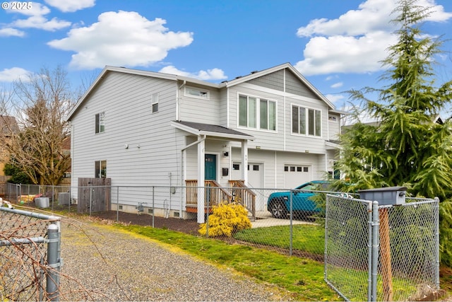9911 SE Duke St, Portland, OR 97266 - view of front of home featuring an attached garage, driveway, and a fenced front yard