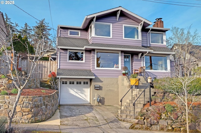 view of front of property with a garage