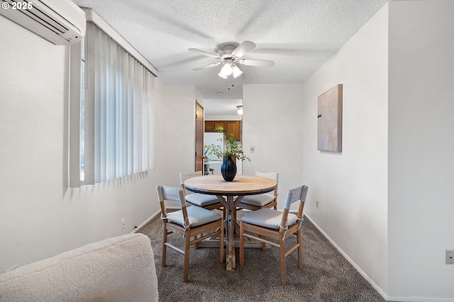 carpeted dining room featuring a wall unit AC, a textured ceiling, and baseboards