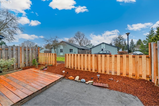 view of yard with fence private yard and a deck