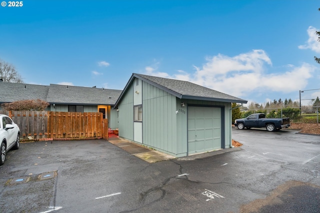 detached garage with fence