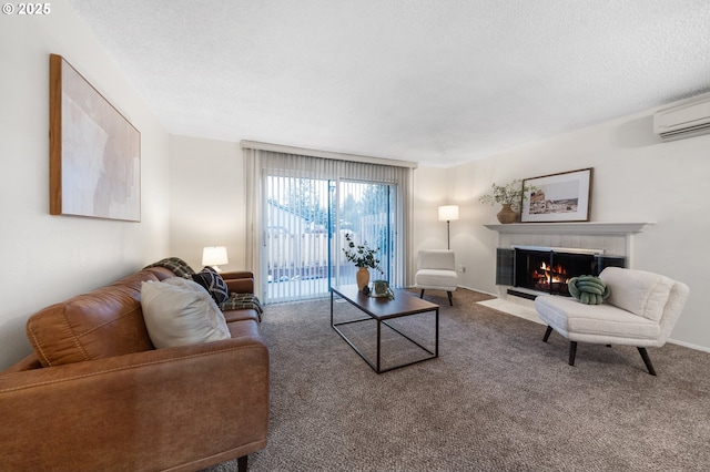 carpeted living room featuring a textured ceiling, a wall mounted AC, a tiled fireplace, and baseboards