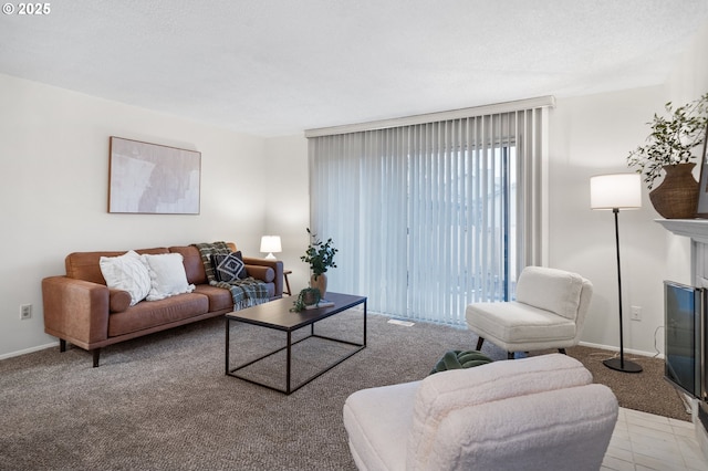 living area with light carpet, a fireplace, and baseboards