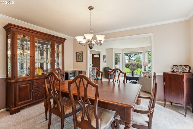 dining space with a chandelier, light colored carpet, and ornamental molding