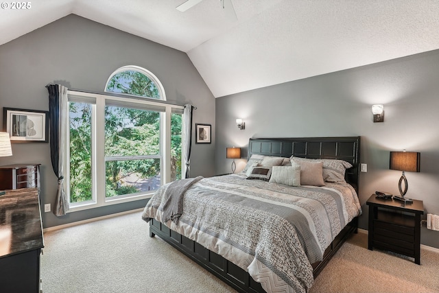 carpeted bedroom with baseboards and high vaulted ceiling