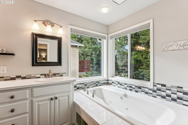 full bathroom featuring vanity and a whirlpool tub