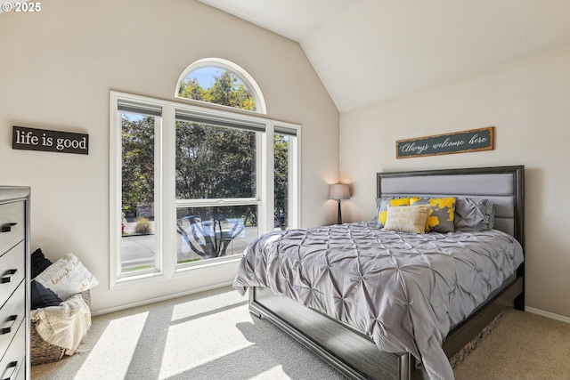 carpeted bedroom featuring vaulted ceiling