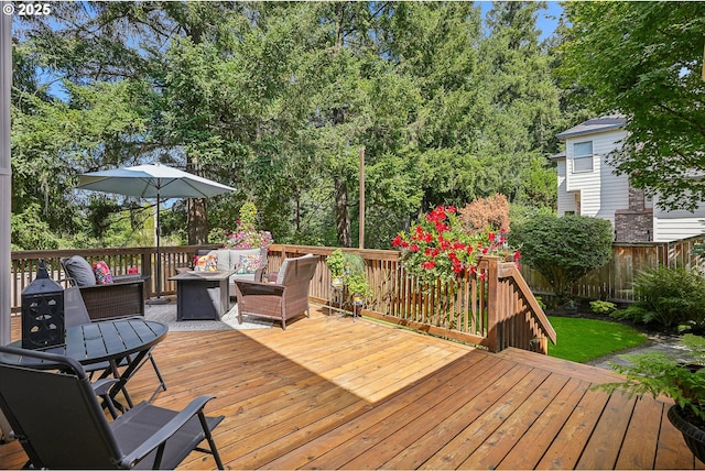 wooden deck featuring an outdoor living space, fence, and outdoor dining space