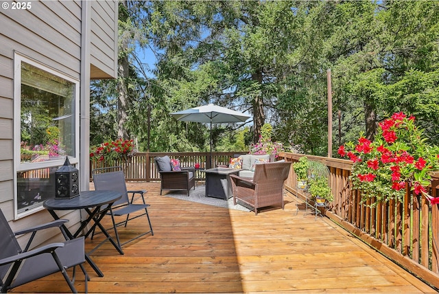 wooden terrace with outdoor lounge area