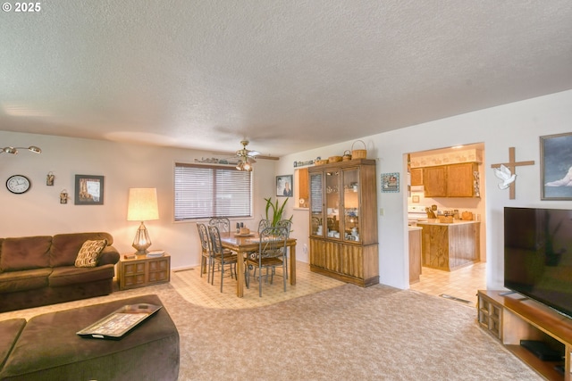 1318 SW 39th Ave, Pendleton, OR 97801 - living area featuring a textured ceiling, ceiling fan, and light carpet