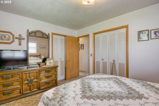 1318 SW 39th Ave, Pendleton, OR 97801 - bedroom with carpet, two closets, and a textured ceiling