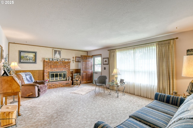 1318 SW 39th Ave, Pendleton, OR 97801 - carpeted living room with a wainscoted wall, a fireplace, a textured ceiling, and wooden walls