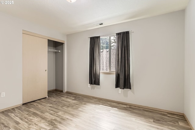 1165 SE 85th Ave, Portland, OR 97216 - unfurnished bedroom with light wood-type flooring and a closet