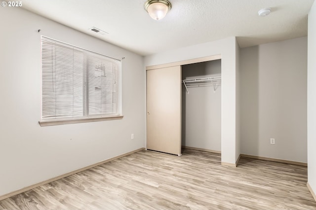 1165 SE 85th Ave, Portland, OR 97216 - unfurnished bedroom with light wood-style flooring and a closet