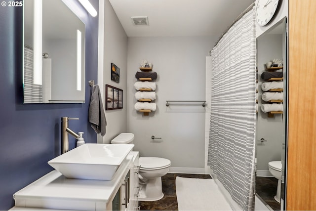 1420 NW Lovejoy St Unit 518, Portland, OR 97209 - bathroom with toilet, vanity, baseboards, and a shower with shower curtain