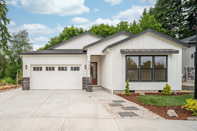 5404 NE 111th St, Vancouver, WA 98686 - modern farmhouse style home featuring concrete driveway, a garage, board and batten siding, and roof with shingles