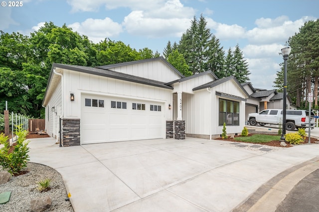 5404 NE 111th St, Vancouver, WA 98686 - modern farmhouse featuring concrete driveway, an attached garage, and board and batten siding
