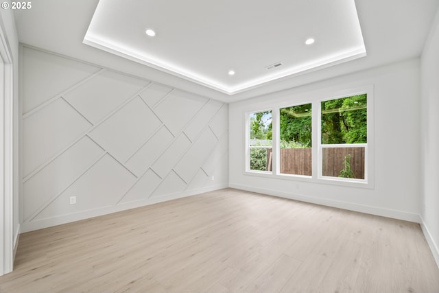 5404 NE 111th St, Vancouver, WA 98686 - spare room with light wood-style flooring, a raised ceiling, and recessed lighting