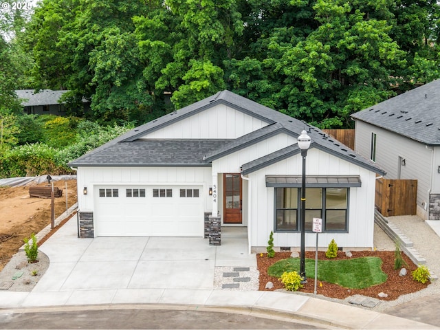 5404 NE 111th St, Vancouver, WA 98686 - modern inspired farmhouse featuring a shingled roof, board and batten siding, driveway, and a garage