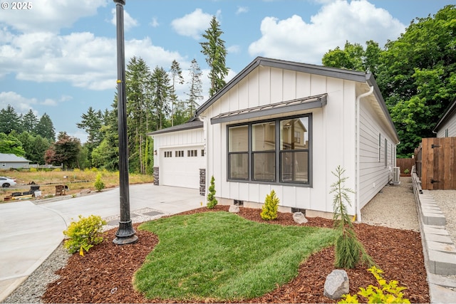 5404 NE 111th St, Vancouver, WA 98686 - view of front of house with board and batten siding, concrete driveway, and an attached garage