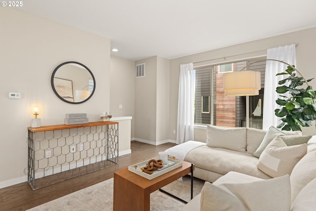 5026 SE Mill St, Portland, OR 97215 - living area featuring wood finished floors, baseboards, and recessed lighting