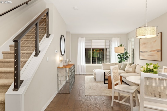 5026 SE Mill St, Portland, OR 97215 - living room featuring dark wood-style floors, baseboards, and stairs